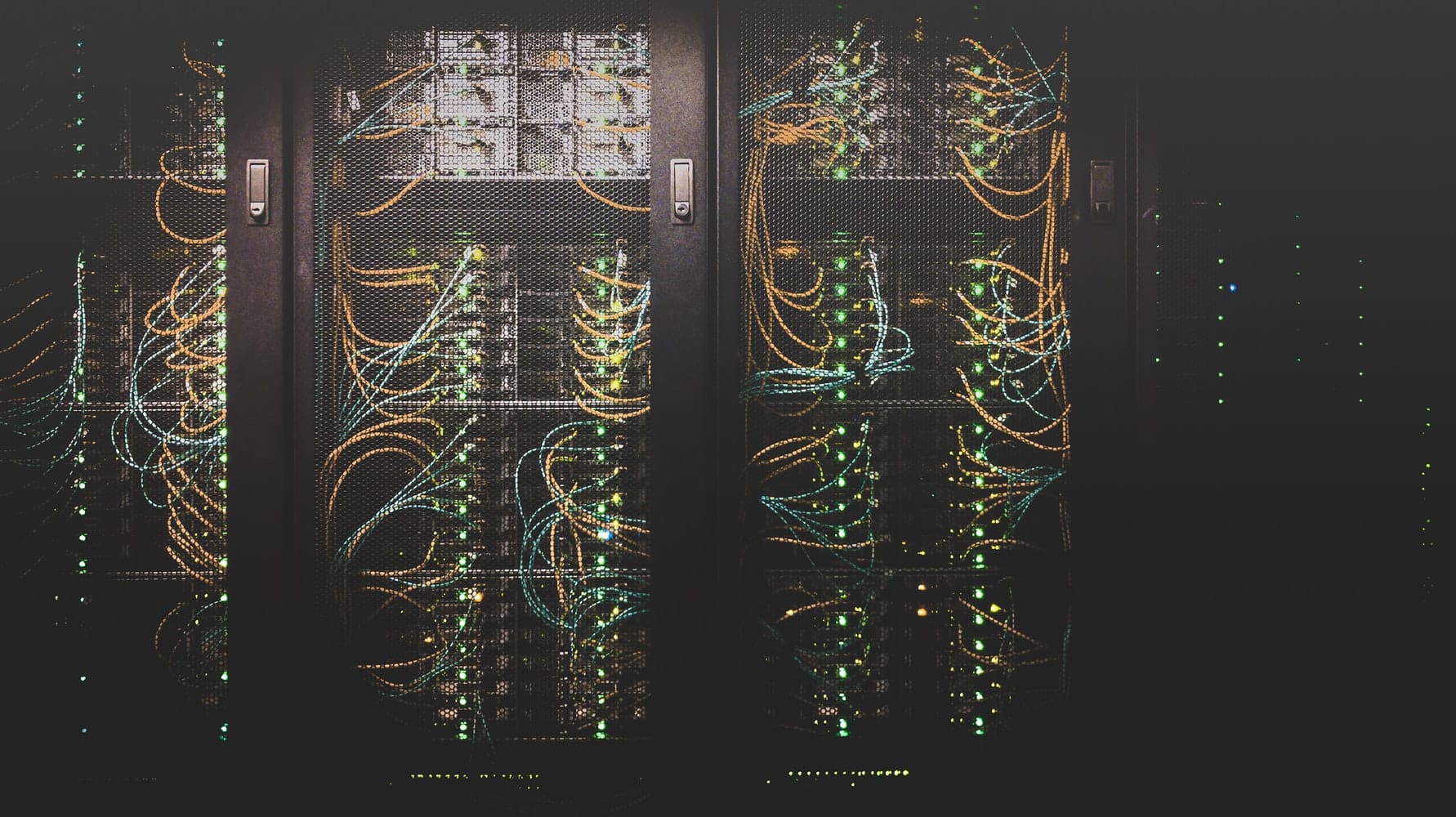 Network boxes and wires inside of a cage